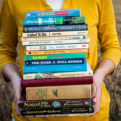 Carrying an armful of books